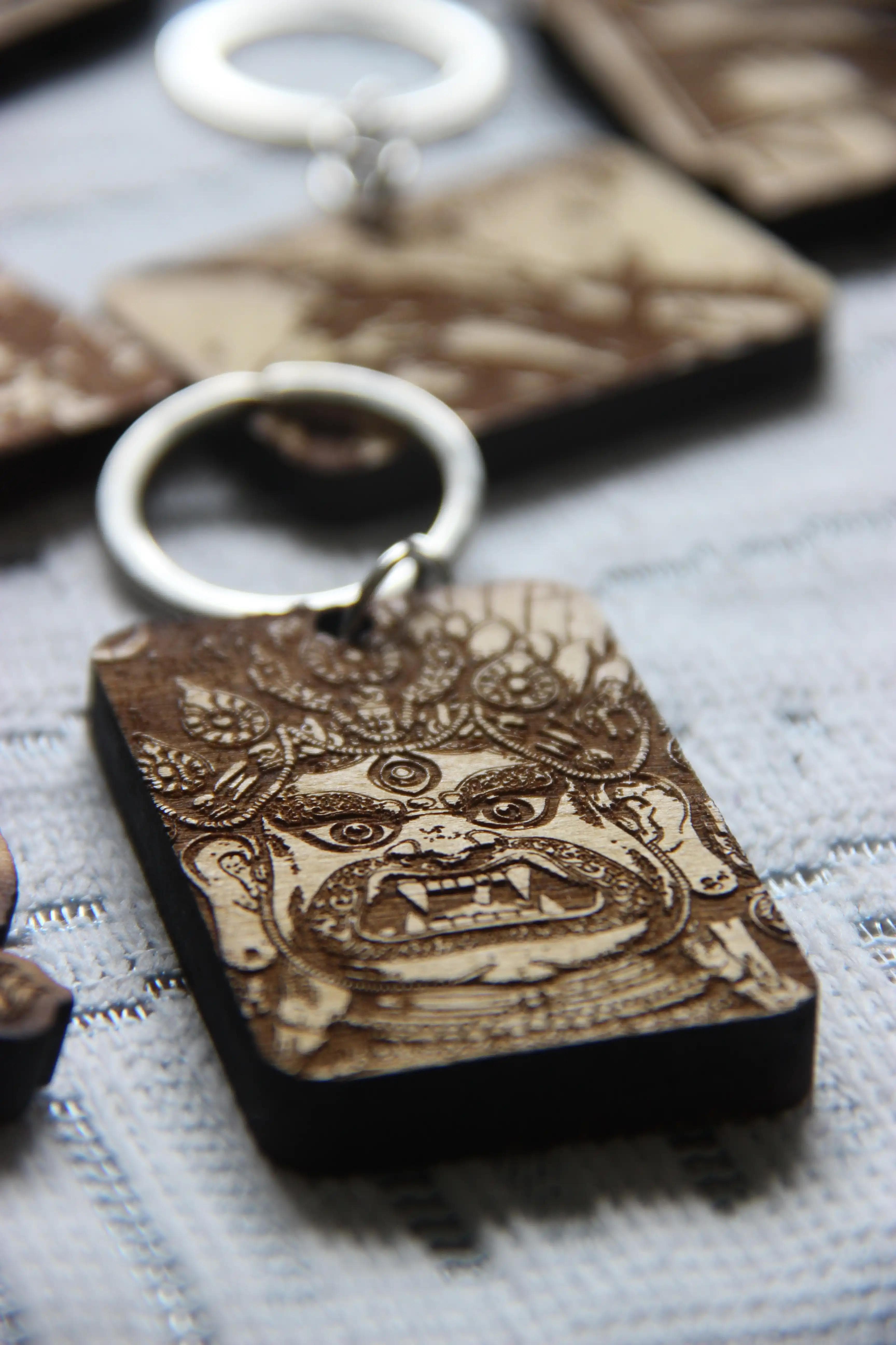 Handcrafted Bhairava Keyring in engraved wood finish